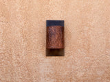 Copper light sconce with leather textured copper band + Steel backplate by Mike Dumas Copper Designs..